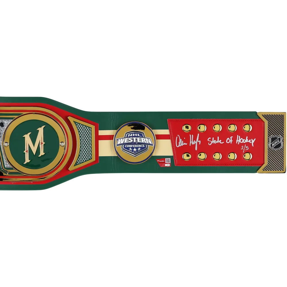 A hockey championship belt plaque featuring the Western Canada Championship logo, a large gold 'M' on a green background, and a red section with an autographed 'Owen Hahne State of Hockey 2/5' signature.