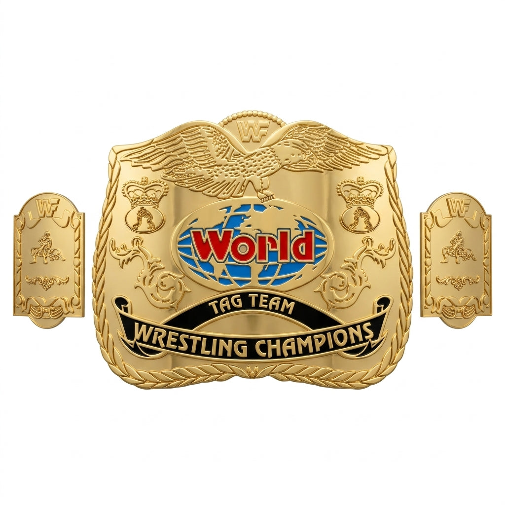 A gold-colored championship belt plaque with two side plates, featuring an eagle at the top, a blue and red globe with the text 'World' in red, and a black banner reading 'TAG TEAM WRESTLING CHAMPIONS'.