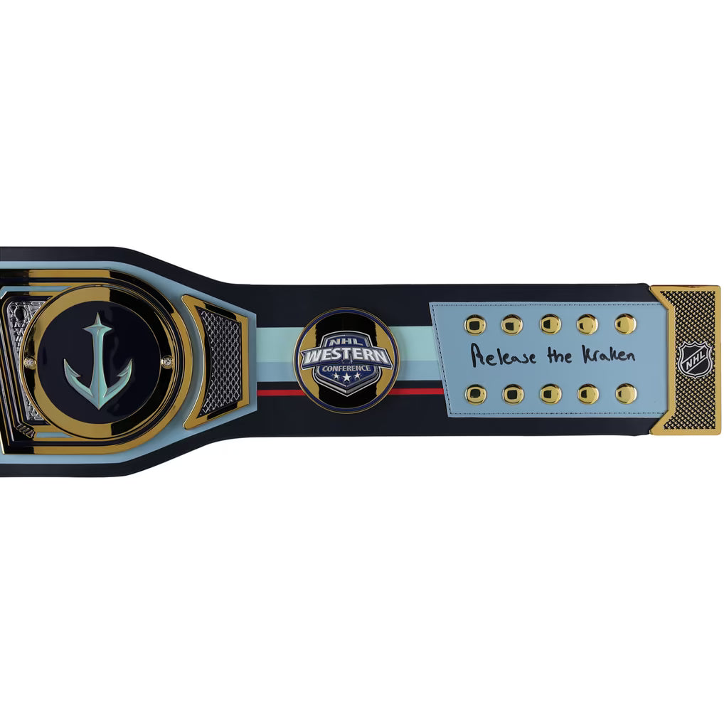 A custom championship belt featuring a large anchor emblem on the front, a central circular 'Western Championship' logo, and a light blue panel with gold studs and the handwritten text 'Release the Kraken'. The belt has a black, gold, and light blue color scheme with a hockey stick design on the side.