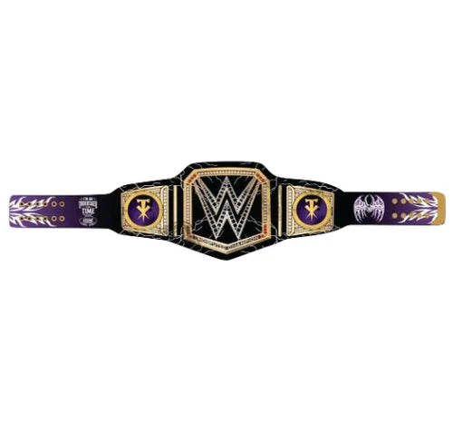 WWE Championship belt featuring a black and purple design with gold trim, a large central shield with the WWE logo, and side plates with circular medallions.