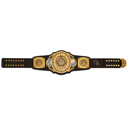 A black and gold championship-style belt with ornate central plaque, decorative side plates, and a black strap with gold studs, shown on a plain white background.