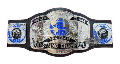 A wrestling championship belt featuring a large central silver plate with blue and black details, flanked by two side plates, on a plain white background.