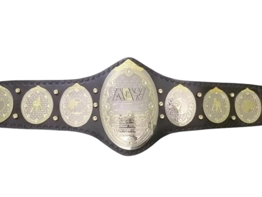 A championship belt with a black textured strap and multiple oval and round gold-toned and silver-toned medallions, including a large central AEW logo plate, shown against a plain white background.