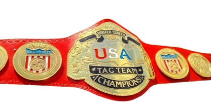 A red and gold United States Tag Team Champions belt with a large central gold plate and four matching side medallions, shown against a plain white background.