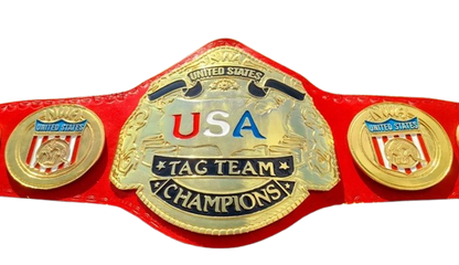 A red and gold USA Tag Team Champions belt with a large central gold plate and two matching side plates on a white background.
