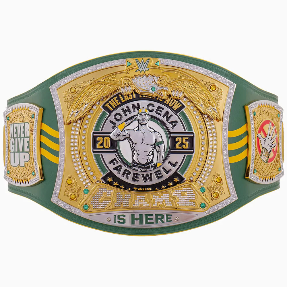 A green and gold championship belt featuring a large central plate with an eagle, the text 'The Last Show John Cena Farewell 2025', and 'Champions Is Here' at the bottom. The belt has three panels, with the center panel being the most detailed and decorated, and the side panels reading 'Never Give Up' and 'Winner'.