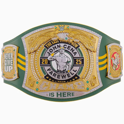 A green and gold championship belt featuring a large central plate with an eagle, the text 'The Last Show John Cena Farewell 2025', and 'Champions Is Here' at the bottom. The belt has three panels, with the center panel being the most detailed and decorated, and the side panels reading 'Never Give Up' and 'Winner'.
