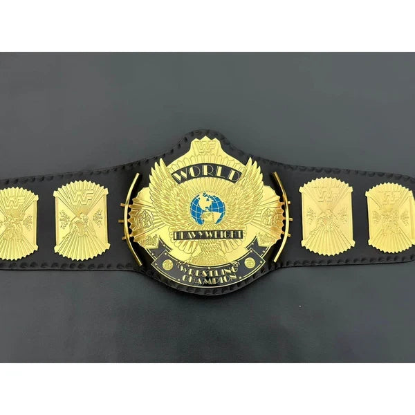 Black championship belt with gold emblem on a black background