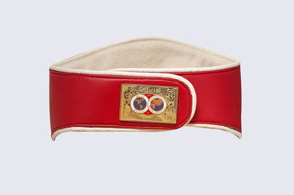 A red leather boxing belt with a beige suede lining and a gold-tone metal buckle featuring the brand name 'Safra' and a double-circle emblem.