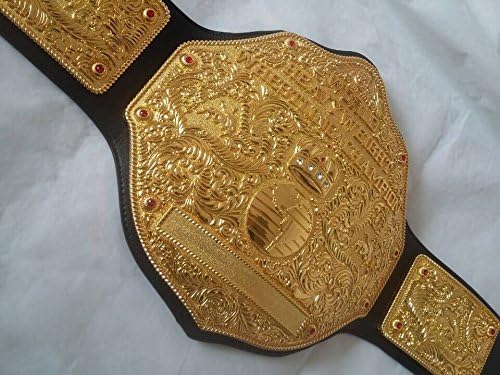 Gold championship belt with intricate designs on a white background