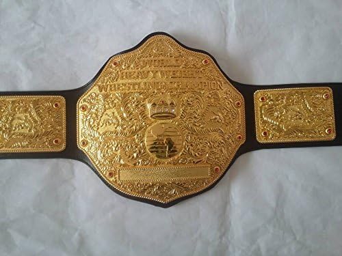 Gold championship belt with intricate designs on a white background