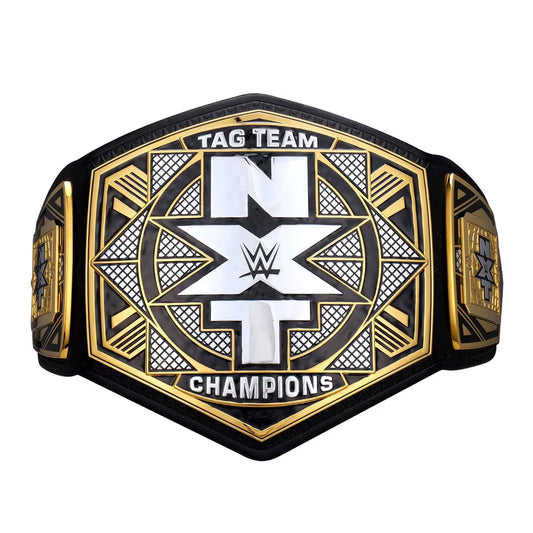 WWE NXT Tag Team Champions belt featuring a black and gold hexagonal design with a large white 'NXT' logo in the center, on a plain white background.