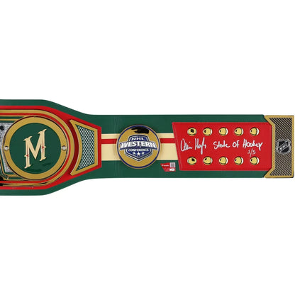 A hockey championship belt plaque featuring the Western Canada Championship logo, a large gold 'M' on a green background, and a red section with an autographed 'Owen Hahne State of Hockey 2/5' signature.