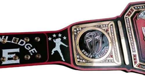 Wrestling championship belt with prominent logo and text on a white background