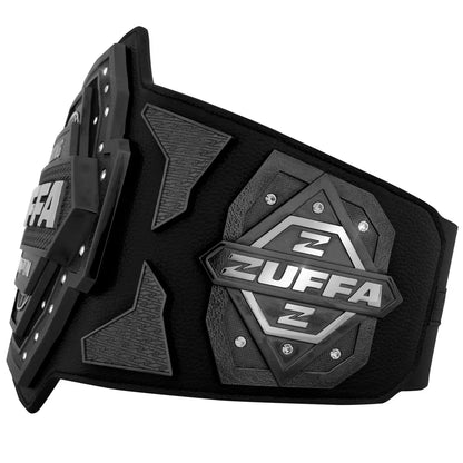 A black Zuffa belt with textured black panels and silver metallic accents, featuring the Zuffa brand name and logo on the front plates, shown on a plain white background.