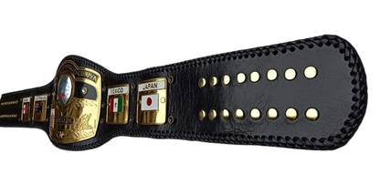 A black leather championship belt with gold-tone hardware and multiple country name plates, shown on a plain white background.