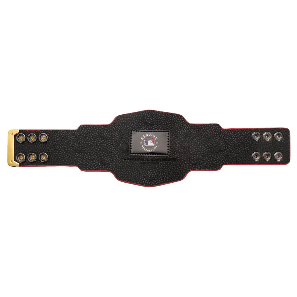 A black studded championship-style belt with a gold-toned front plate and silver-toned rivets, featuring a central MLB patch, shown on a plain white background.