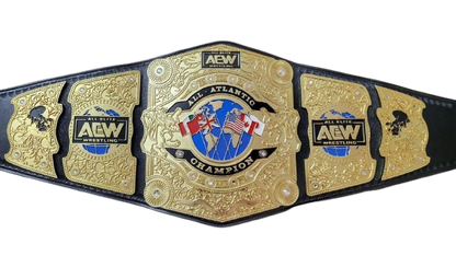 A gold and black AEW All Atlantic Wrestling Championship belt, featuring ornate gold plates with detailed engravings and the AEW logo, set against a plain white background.