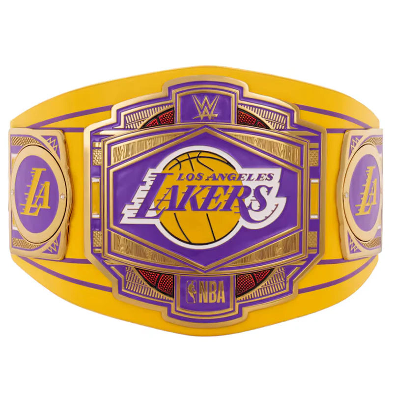 A Los Angeles Lakers WWE championship belt featuring a large central plate with the Lakers logo, flanked by two side plates with the LA monogram, all on a yellow and purple strap with gold trim.