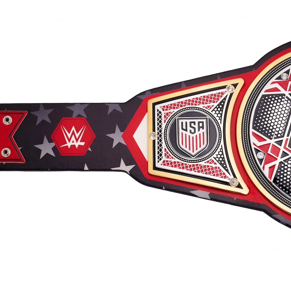 A WWE USA Championship belt shown in a close-up side view against a white background, featuring a black strap with red and white star patterns, a red WWE logo, and a central gold, red, and black plate with 'USA' and a shield emblem.