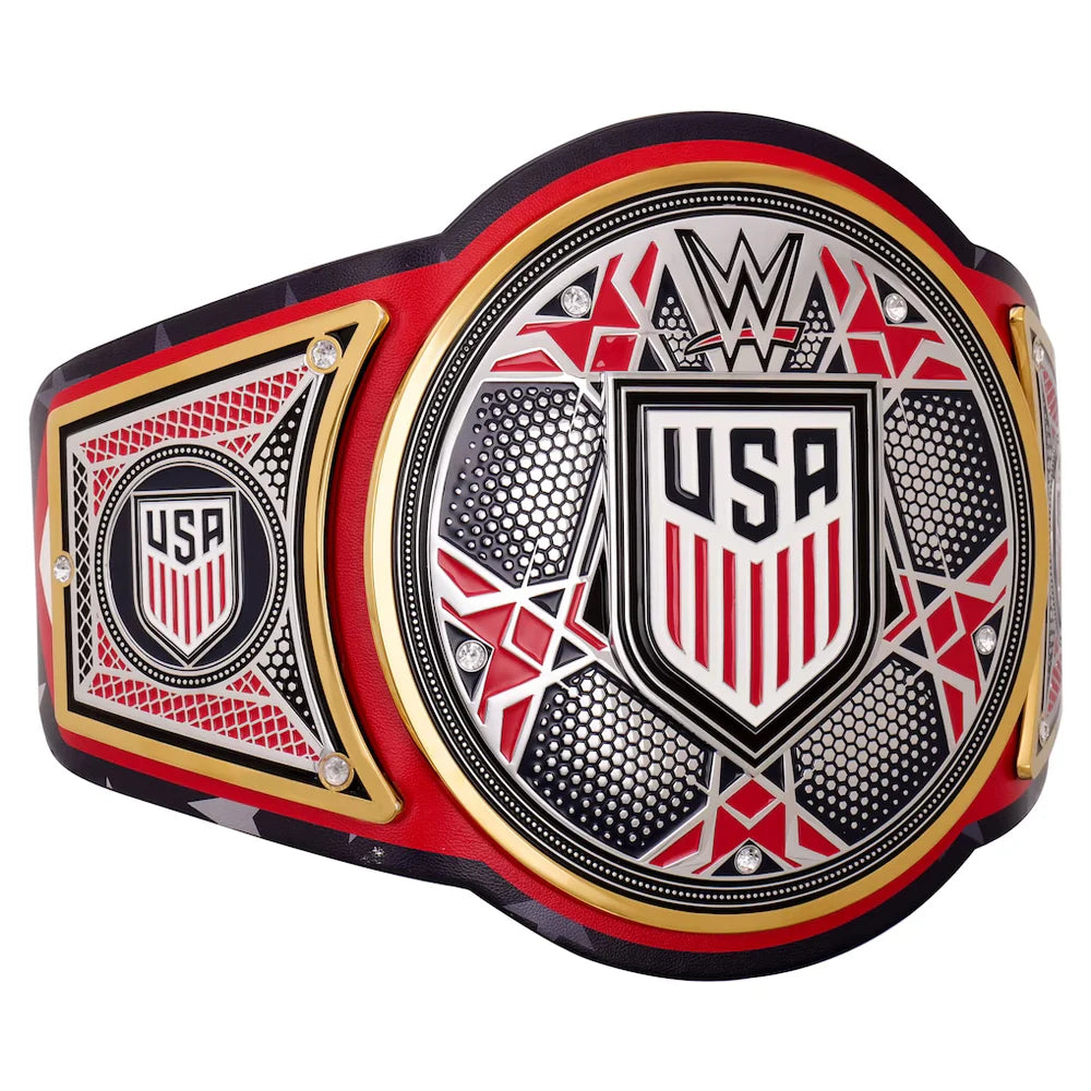 A WWE USA Championship belt shown in a close-up side view against a white background, featuring a black strap with red and white star patterns, a red WWE logo, and a central gold, red, and black plate with 'USA' and a shield emblem.