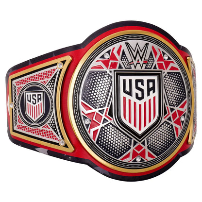 A WWE USA Championship belt shown in a close-up side view against a white background, featuring a black strap with red and white star patterns, a red WWE logo, and a central gold, red, and black plate with 'USA' and a shield emblem.