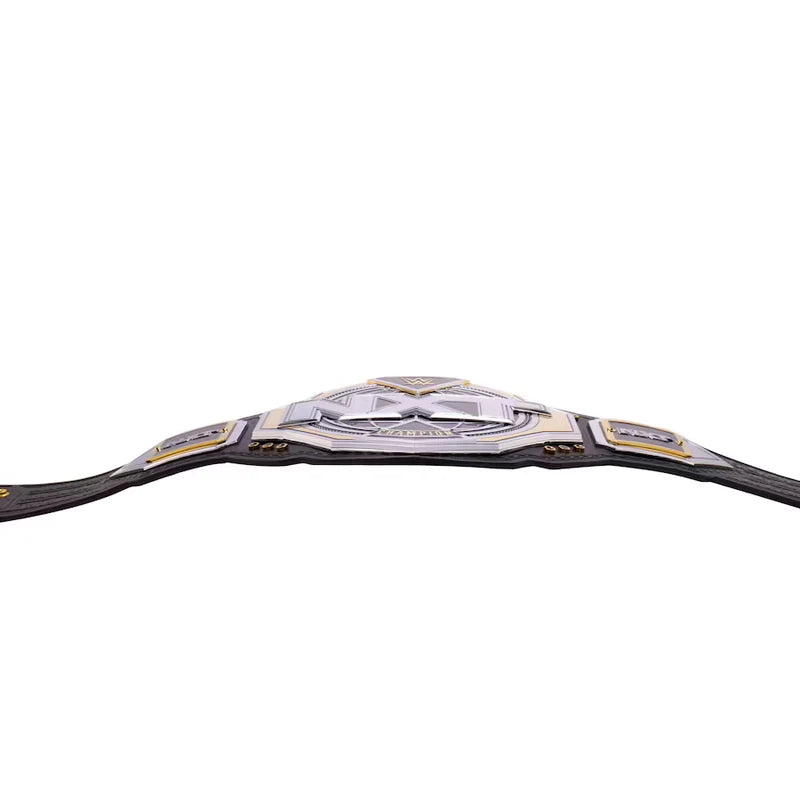 A championship belt with a large central silver-toned plate featuring a stylized skull emblem and the text 'WRESTLING WORLD CHAMPIONSHIP', flanked by two smaller gold and silver plates, all on a black strap, shown against a plain white background.