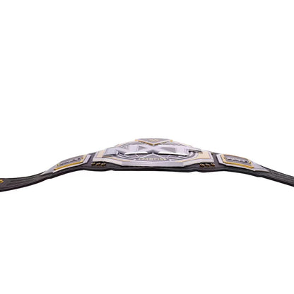 A championship belt with a large central silver-toned plate featuring a stylized skull emblem and the text 'WRESTLING WORLD CHAMPIONSHIP', flanked by two smaller gold and silver plates, all on a black strap, shown against a plain white background.