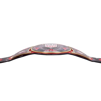 A close-up of a championship belt buckle with red, white, and black detailing, shown against a plain white background.