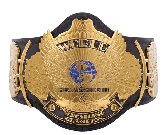 A gold and black WWE Heavyweight Championship belt with an ornate eagle design and blue globe emblem on the center plate, isolated on a white background.