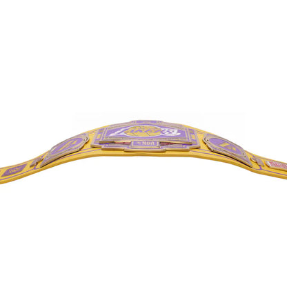 A gold and purple Los Angeles Lakers championship belt shown from a low angle against a solid white background.