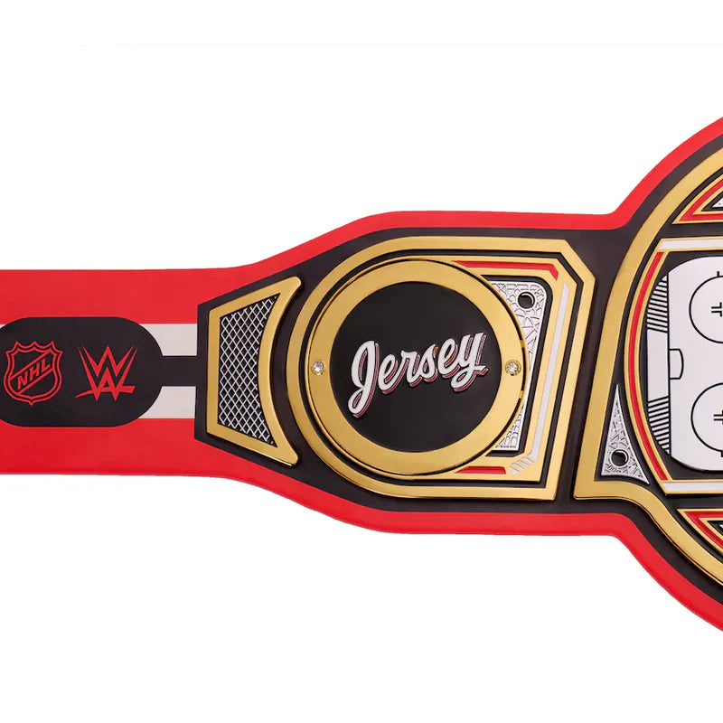 A replica WWE Wrestle Kingdom 25 Jersey Championship belt shown in a side profile view against a plain white background. The belt features a red strap, a central gold and black plate with 'Jersey' written in white script, and logos for WWE, NFL, and WBC on the left side.