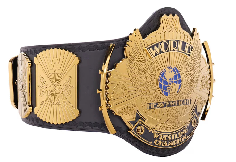 Black and gold wrestling championship belt with detailed design on a white background