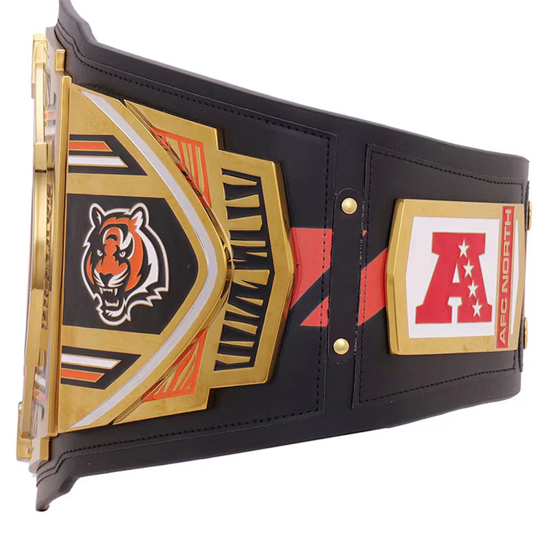 Black championship belt with gold and red accents featuring a tiger logo and letter 'A'.