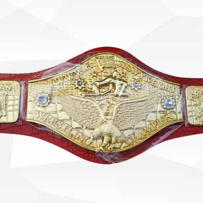 Wrestling championship belt with gold and red design on a white background