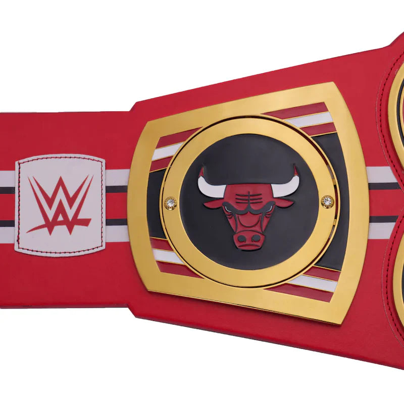 Red championship belt with gold buckle featuring a bull logo and WWE logo on a white background