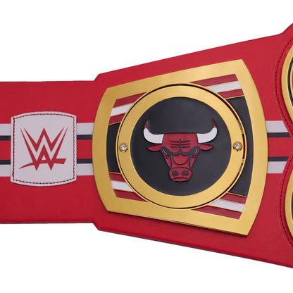 Red championship belt with gold buckle featuring a bull logo and WWE logo on a white background