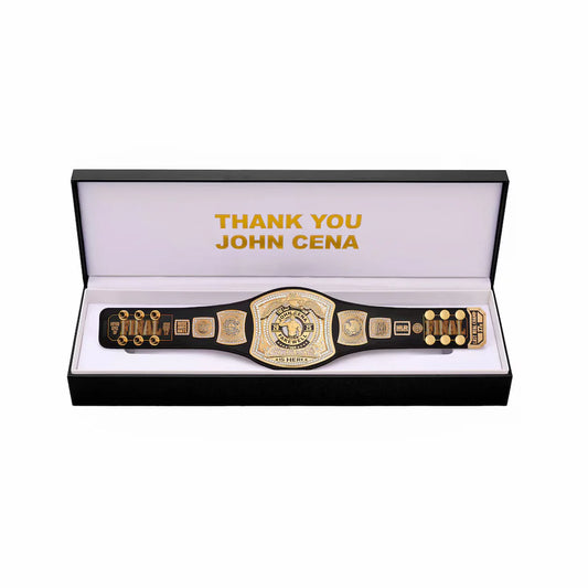 Wrestling championship belt in a display case with 'Thank You John Cena' text.