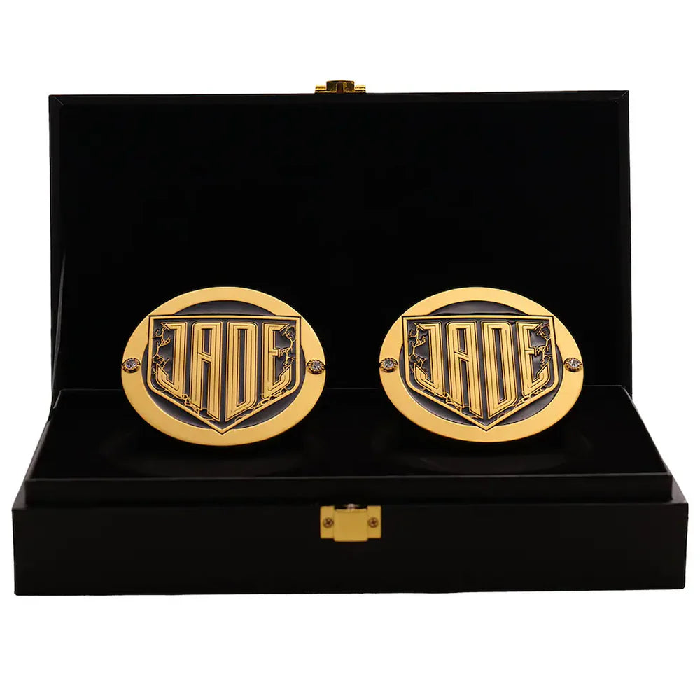Gold cufflinks with a logo in a black display box Jade Cargill 16MM Replica Side Plate Box Set