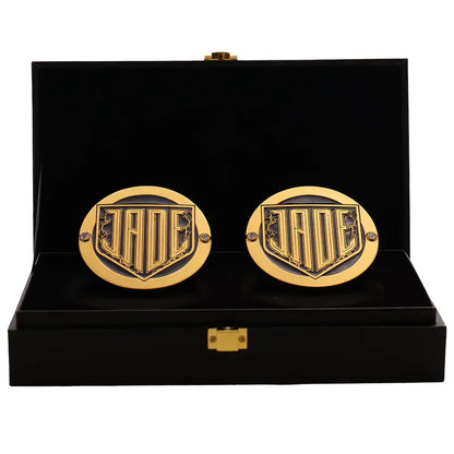 Gold cufflinks with a logo in a black display box Jade Cargill 16MM Replica Side Plate Box Set