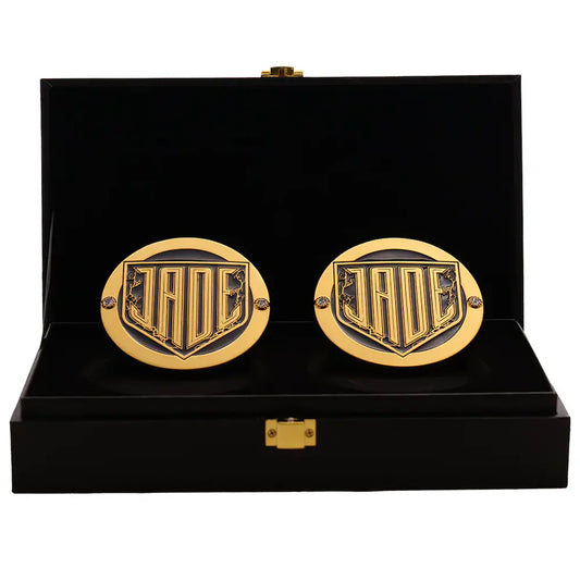 Gold cufflinks with a logo in a black display box Jade Cargill 16MM Replica Side Plate Box Set