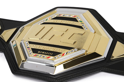 UFC championship belt with gold and black design on a white background