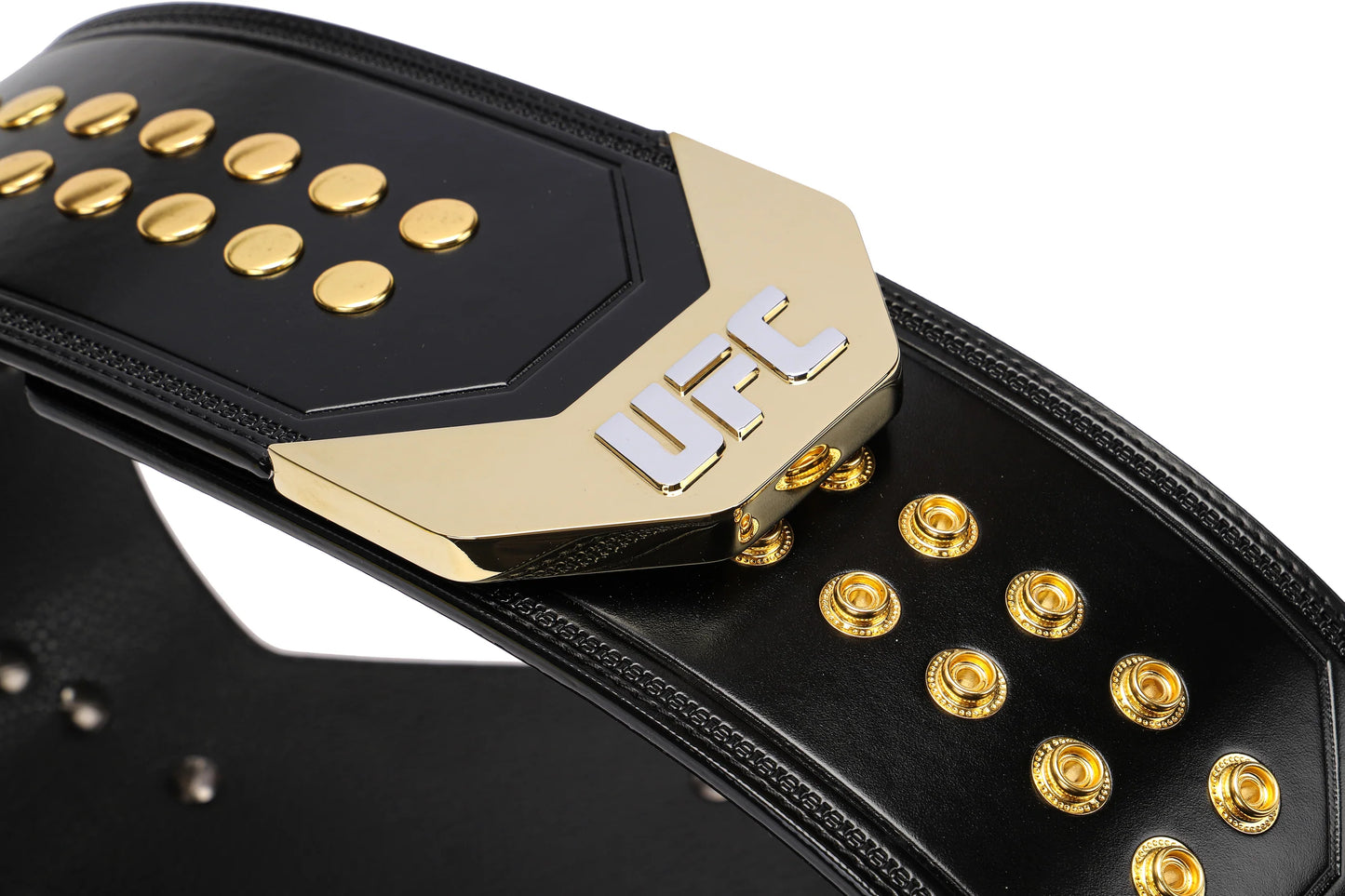 Black and gold UFC championship belt with gold buttons on a white background
