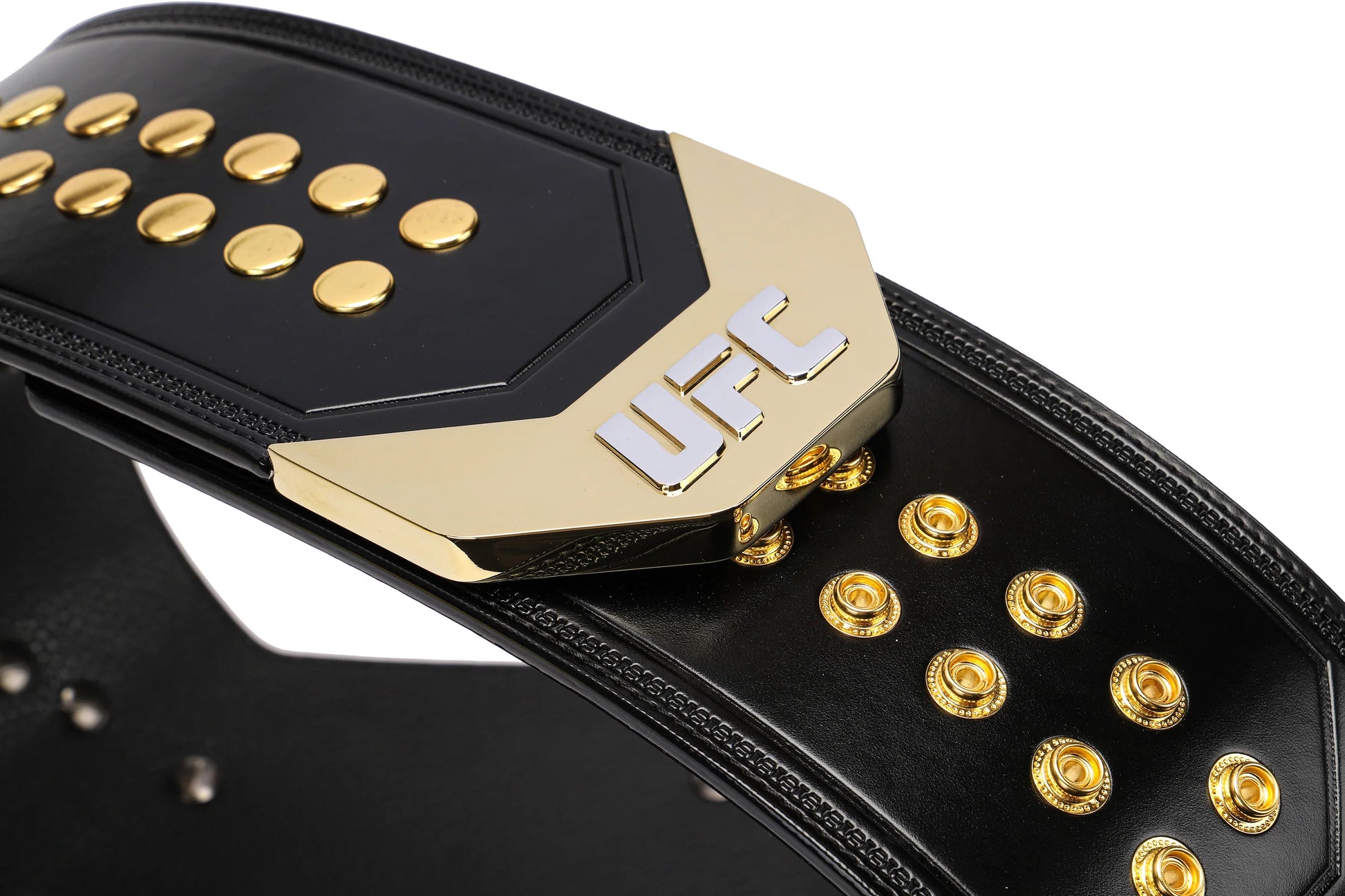 Black and gold UFC championship belt with gold buttons on a white background