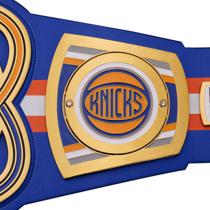 Championship belt with 'Knicks' logo on a blue background