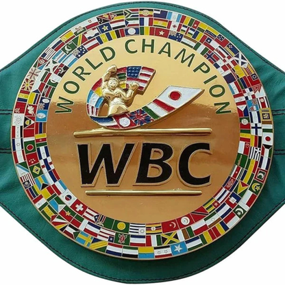WBC World Champion belt buckle with flags around the rim on a green background