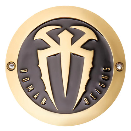 Decorative emblem with gold and black design on a white background