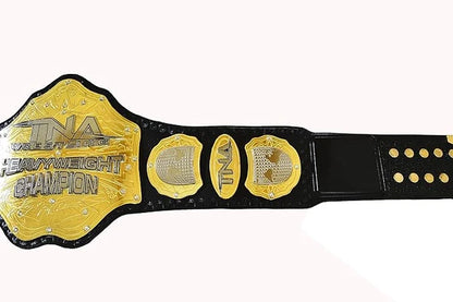 A black and gold TNA Wrestling Heavyweight Championship belt shown against a plain white background.