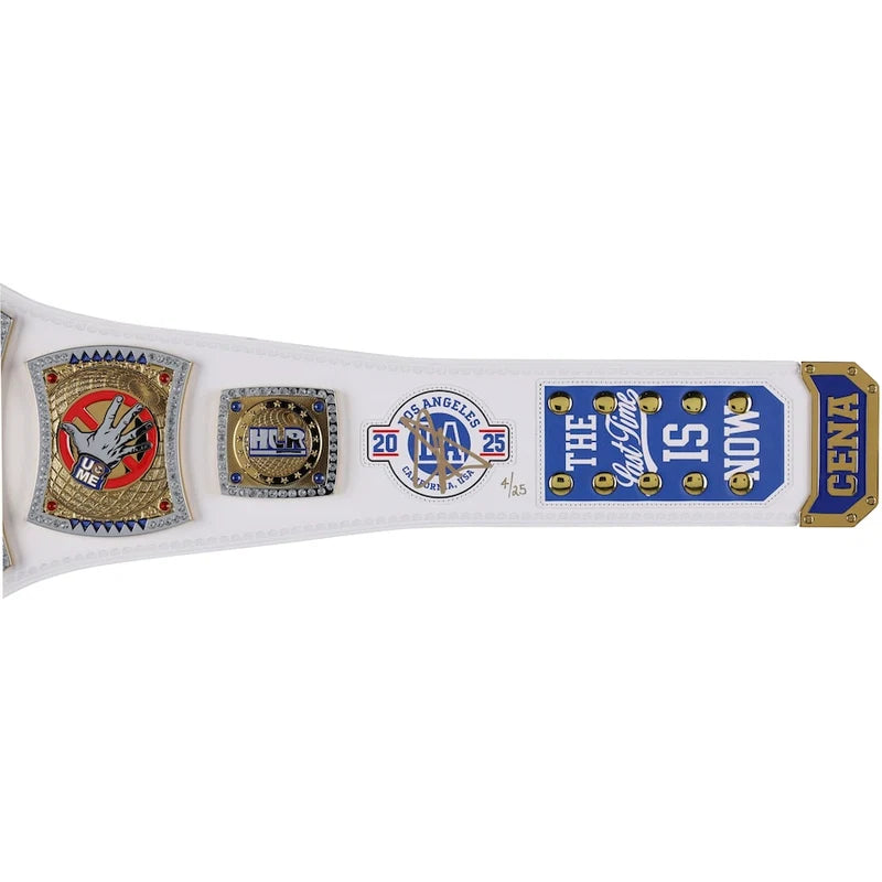 A white championship belt featuring multiple gold, blue, and red metallic and enamel plates, including a Los Angeles Lakers logo, a CENA award plaque, and a gold-toned end cap.