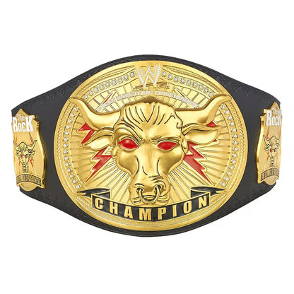 WWE Raw Championship belt featuring a large gold-toned central plaque with a bull head and red eyes, flanked by smaller gold side plaques, all mounted on a black strap against a white background.